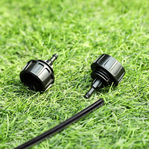 Five Pack One Quarter Inch Drip Irrigation Tubing To Faucet And Garden Hose Adapters Quick Connect Fittings on grass