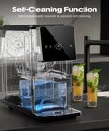 Chewable Nugget Ice Maker For Home And Office, 33 lbs Per Day, self-cleaning feature, black with transparent water tank on counter