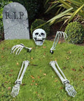 Halloween Skeleton Stakes Pack Of 5 Realistic Skull Arm And Leg Yard Props in lawn with tombstone