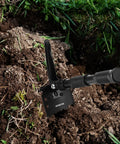 Ultralight Folding Camping Shovel Multitool with digging saw and pick in soil, handle extended, high carbon steel blade.