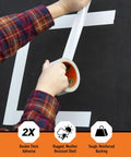 Person applying Beast Tough Heavy Duty White Duct Tape 1.88 Inch Wide By 10 Yards Long Pack Of 6 on black surface.