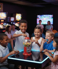 Children enjoying a Killer Vintage Style Red Cast Metal 11 Inch Self Serve Gumball Candy Dispenser Holds Sweet Treats.
