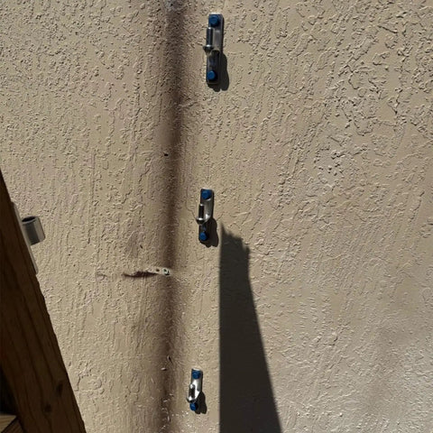 Top Shelf 304 Stainless Steel Gate Hinges Provide A No Sweat Install For Farm Gates Wooden Fences Barn Doors And Modern Yards Featuring Rust Proof Heavy Duty Outdoor Hardware mounted on textured wall.