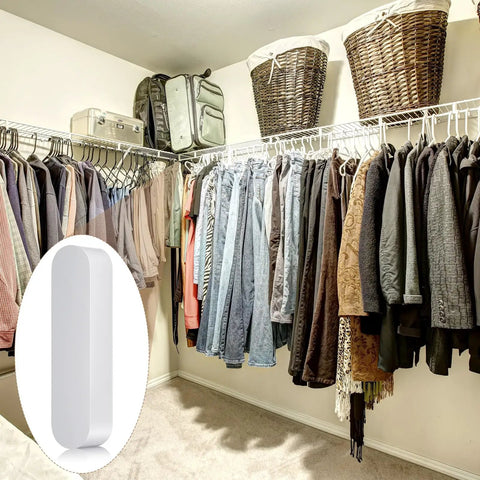 Walk-in closet with clothing and 4 Pack Plastic Rod Spacer Caps for Closet Rods and Wire Shelves End Caps on wire shelves.