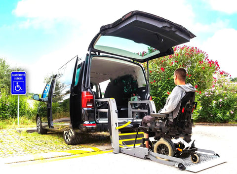 Heavy Duty Aluminum Handicap Parking Sign Ada Compliant Reflective Metal Plaque next to wheelchair van with ramp.