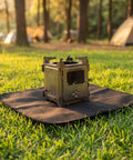 2 Pack Tough Fireproof Mat With High Heat Resistant Carbon Felt Blanket For Welding BBQ Pit And Grill Stove To Stop Sparks Safe Underlay under a camping stove on grass.