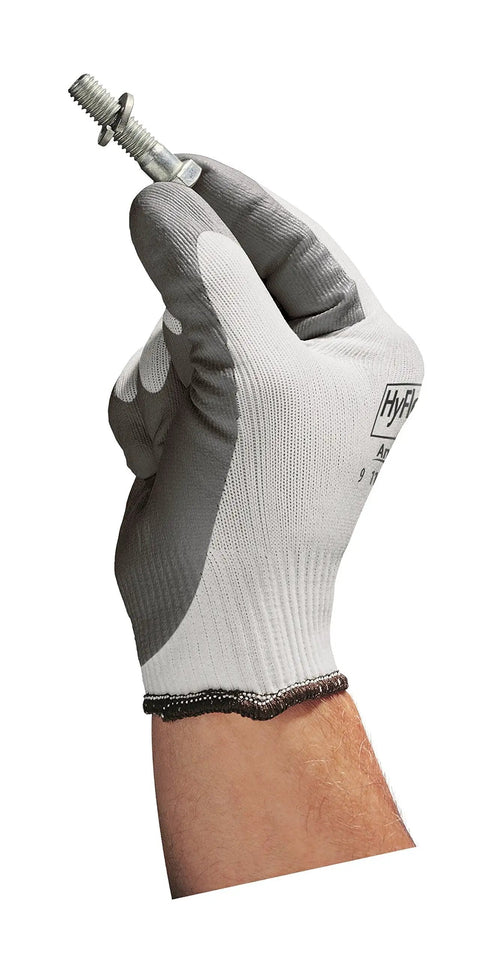 Hand wearing Nylon Glove With Gray Foam Nitrile Coating For Light Oil, Knit Wrist Cuff, Size 11 XX Large, pack of 12, holding a bolt.
