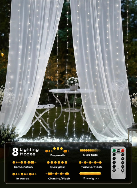 Curtain Fairy Lights With Remote, 300LEDs White Waterproof String Lights draped behind outdoor table and chairs, with 8 modes.