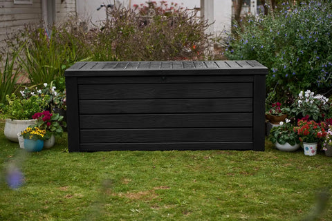 Beefy Westwood 150 Gallon Resin Outdoor Storage Box for Patio in garden setting, dark grey, lockable