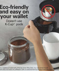 Hand using 2 Way Programmable Coffee Maker With Single Serve And 12 Cup Glass Carafe Black With Stainless Steel Accents Easy Scoop