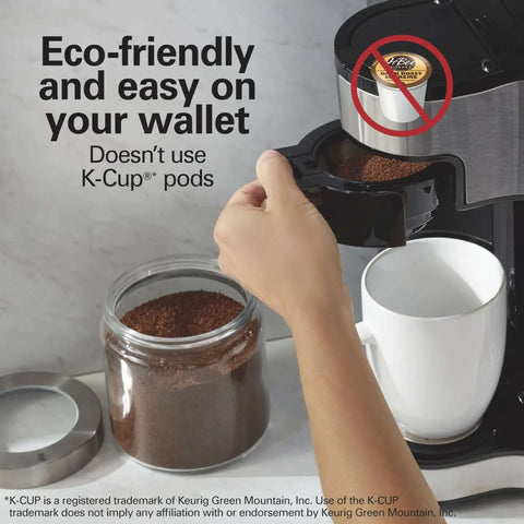 Hand using 2 Way Programmable Coffee Maker With Single Serve And 12 Cup Glass Carafe Black With Stainless Steel Accents Easy Scoop
