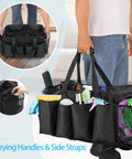 Person holding Big Ol Extra Large Cleaning Caddy Organizer With Sturdy Handles Five-Compartment Tote in black, filled with supplies.