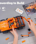 Hands assembling Remote And App Controlled Off Road Truck Building Kit With 740 Plus Pieces STEM Learning Toy on a table