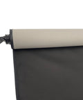 Sunshade roller for car sunroof; beige top, black fabric, side view with attachment clip.