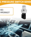 MR306627 Air Conditioning Pressure Switch Sensor next to Mitsubishi Lancer car interior air vent.