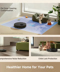 Front view: DREAME L40 Ultra Gen 2 robot vacuum and mop, black, on blue pet-cleaning mat beside a dog bed