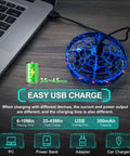 Hand Operated Flying Toy Drone For Kids With Gesture Control And 360 Degree Motion Sensors LED Lights Easy Indoor UFO Ball Drone For Ages 6 To 10 And Up Kid Friendly Blue shown with USB cable connected to laptop, highlighting quick charging feature.