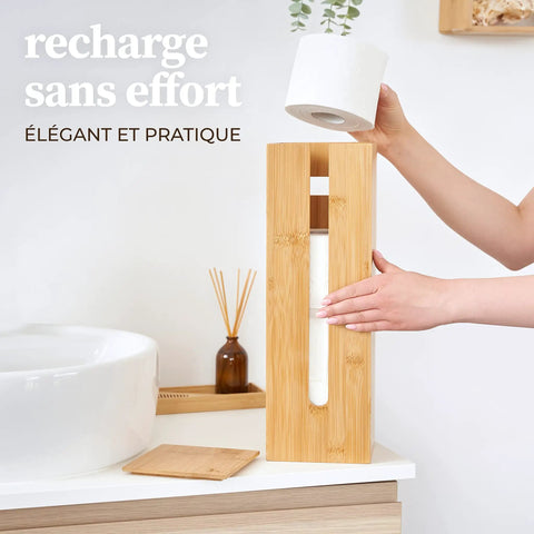 Person placing roll in Bamboo Toilet Paper Storage Holder With Lid On A Sturdy Bamboo Base, Space Saving Roll Dispenser