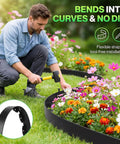 Man installing Landscape Edging Kit 1.5 Inch By 100 Foot Plastic Garden Border With 120 Spikes No Dig Black Border for flower beds