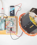 Arduino setup from Six Pack Arduino Starter Kits For Classroom Use with English Projects Book, showing electronic components.