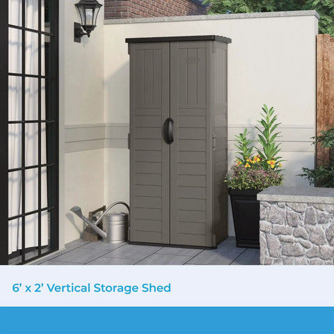 Vertical Outdoor Storage Shed With 22 Cubic Feet Of Capacity placed in a patio setting, showing lockable double doors