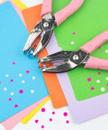 Star Shaped Handheld Paper Hole Punch With Soft Grip Pink Silicone Cover for Scrapbooks on colorful paper with confetti stars