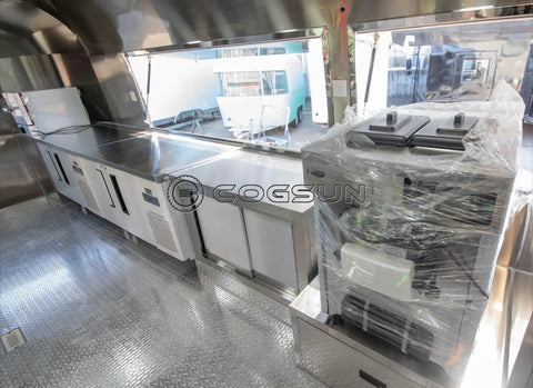 Inside view of Fully Equipped Compact Concession Food Trailer Mobile Kitchen For Street Vending with stainless steel workspace and appliances.