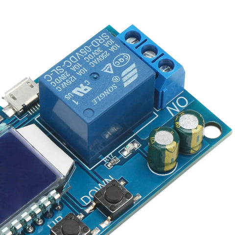 Close-up of a blue Time Delay Timer Relay with LCD Display for 5V 12V 24V systems, showing micro USB port and relay components.