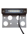 Close-up of 8-Pack 4-Inch LED Hardscape Lights for Pavers and Walls, 2W 2700K Warm White Outdoor Step Lighting, showing mounting holes.