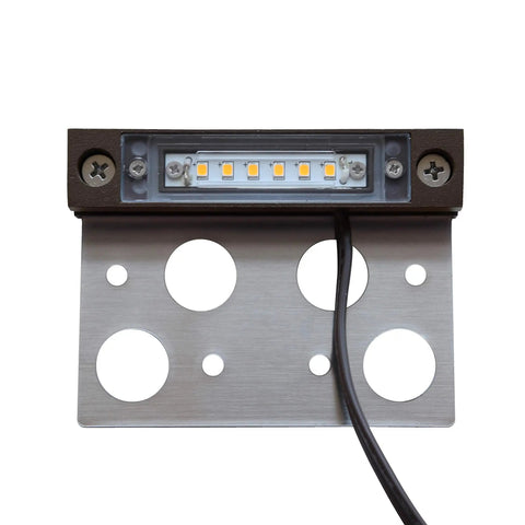 Close-up of 8-Pack 4-Inch LED Hardscape Lights for Pavers and Walls, 2W 2700K Warm White Outdoor Step Lighting, showing mounting holes.