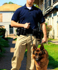 Officer with German Shepherd wearing Police Security Modular Duty Belt Loadout with Colt 1911 holster and pouches