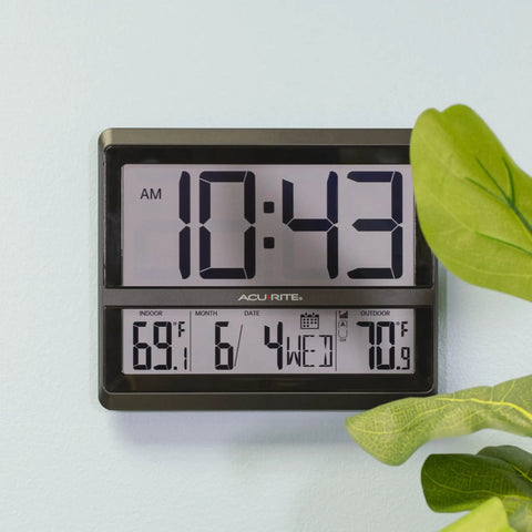 Huge Wireless Atomic Clock With Indoor And Outdoor Temperature, Humidity, Date, Day Of Week, And Automatic DST Adjustments, NIST Radio Controlled Time With Easy Setup For Home Or Office, wall-mounted view with time, temperature, and date displayed.