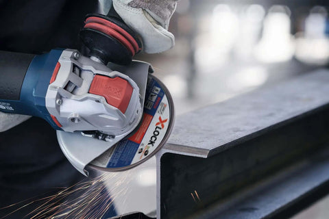 Pro Level 5 Inch Angle Grinder With Fully Variable Speed Control And Multi Grip Paddle Switch Powered By A Badass 13 Amp Motor And Rock Solid X-Lock Quick Change Mount For Heavy Grinding And Precision Cutting in action on metal.