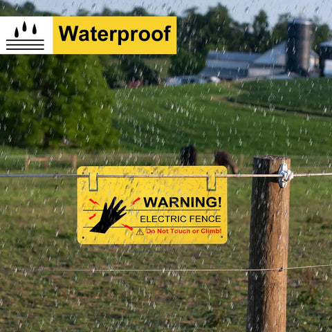 Electric Fence Warning Signs Set Of 10, 9.6 By 5 Inches, Durable Plastic For Farm And Home, Easy Mount With 5 Holes, Weatherproof Signage That Sticks Firmly To Keep Livestock And Property Safe. Waterproof yellow electric fence warning sign on post in rain.
