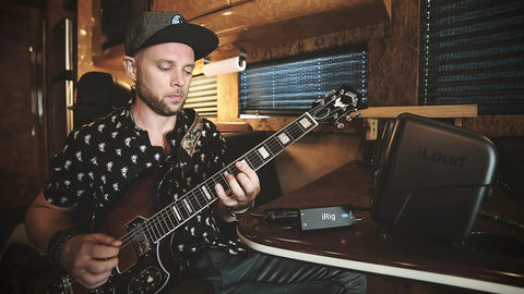 Musician using Guitar Audio Interface For iPhone iPad Mac PC With 24 Bit 96 Kilohertz Recording USB C Lightning And USB Cables
