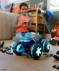 Child playing with Mega-Wrex 1:15 Scale RC Monster Truck With Lights And Sounds, surrounded by toy cars on a wooden floor