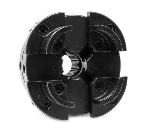 4-inch black four-jaw self-centering lathe chuck with threaded center bore.