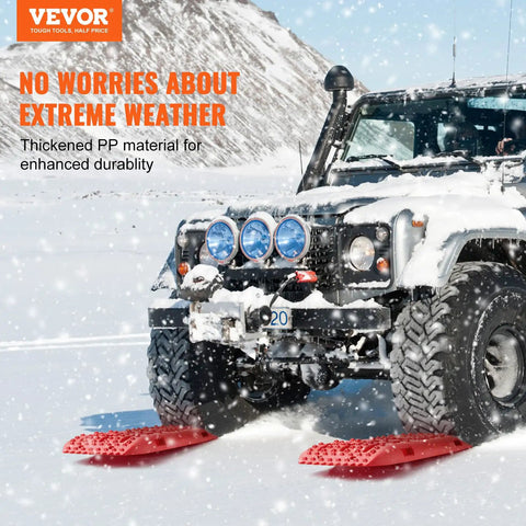 Off-road vehicle using Long Red 10 Ton Traction Boards For Off Road Adventures, Beefy Heavy Duty Recovery Mats Made Of PP Material For Trucks SUVs Jeeps Pickups And RVs, Great In Snow Sand Mud And Loose Terrain, Includes Storage Bag on snowy terrain
