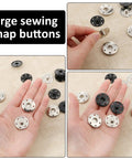 24 Sets Large Snaps For Sewing 25mm Aluminum Snap Buttons Sew On Snaps Big Press Fasteners For Clothing And Fabric In Silver And Black shown in hand