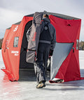 Person entering Quickfish Six Person Portable Pop Up Ice Fishing Shelter With Fully Quilted Insulation No Trip Door And Deluxe Anchors For Hell Of A Winter Setup In Red Black.