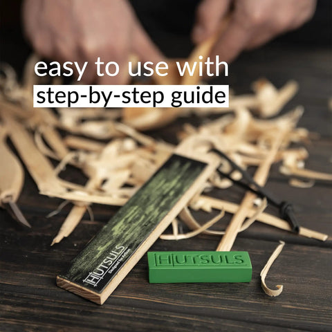 Pocket Knife Strop Kit On The Go Sharpening With Leather Strop And Stropping Compound next to carved wood shavings