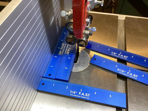 Fence Alignment Tool With Magnetic Stackable Bars For Quick Table Saw Fence Setup And Precise Blade To Fence Spacing Router Bit Height Ruler And Tooth Notch For Woodworking, showing blue rulers on a table saw.