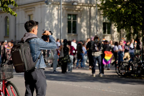 Walker Pro 24L Camera Backpack For Photography And Video Gear With Front Panel Access used by photographer in urban setting