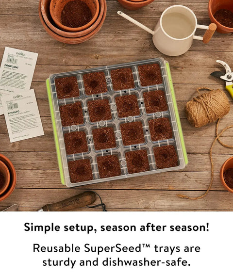 SuperSeed All In One Seed Starting Tray With 16 XL Cells on wooden table, surrounded by gardening tools and pots, reusable and dishwasher safe.