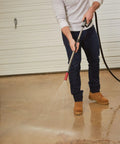 Person using Heavy Duty Watering Wand Sprayer For Garden Hose With Adjustable Tip Rugged Metal Construction on driveway