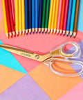 Go-To Everyday Office And Craft Scissors With Titanium Coated Blades And Clear Ergonomic Handles, Durable 3 Pack For Home Desk Or School Projects, Gold Finish For Sharp Clean Cuts. Gold scissors with clear handles on colorful paper