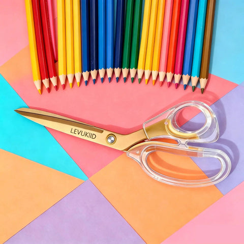 Go-To Everyday Office And Craft Scissors With Titanium Coated Blades And Clear Ergonomic Handles, Durable 3 Pack For Home Desk Or School Projects, Gold Finish For Sharp Clean Cuts. Gold scissors with clear handles on colorful paper