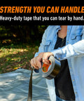 Person using Tough As Nails Heavy Duty Duct Tape With Triple Layer Strength For Indoor And Outdoor Repairs All Weather Shell