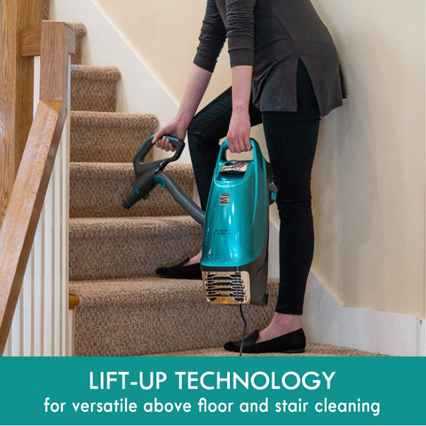 Person using Intuition Lift Up Bagged Upright Vacuum With Two Motor Power Suction And HEPA Filter No Touch Bag Tech on stairs