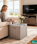 31 Gallon Outdoor Storage Deck Box With Lockable Lid, waterproof resin construction used as side table indoors, taupe color.